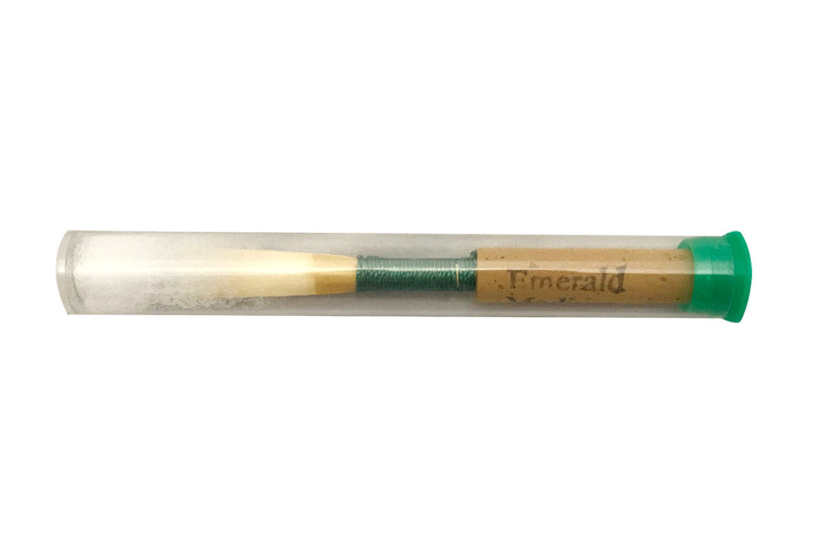 Emerald Oboe Reed in its plastic packaging and storage tube