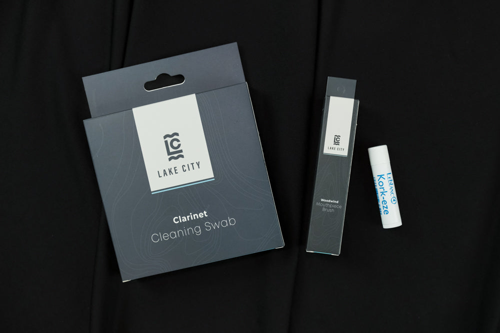 The Lake City Clarinet Bundle. Includes a clarinet cleaning swab, a mouthpiece brush, and a tube of cork grease. 