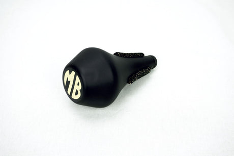 The Marcus Bonna fiberglass straight mute for trumpet on its side