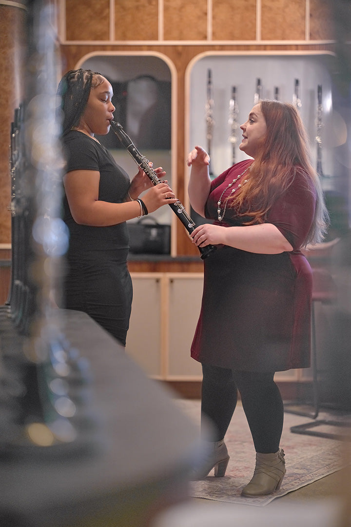 Melissa teaching clarinet to a student