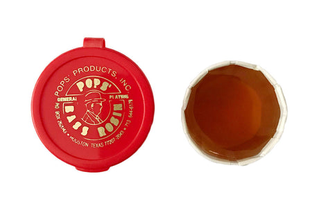 Pops Bass rosin in its paper cup next to its red plastic container