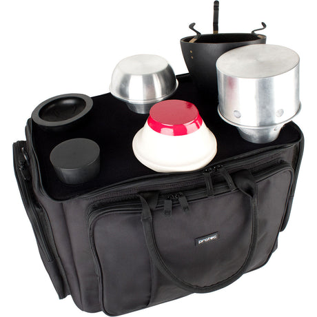 The Protec M407 6-Pack tenor trombone mute bag with 6 mutes sitting on top of the interior lid, allowing for convenient access.