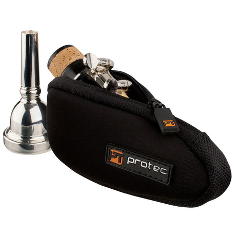 The Protec N264 Single mouthpiece pouch, with a clarinet mouthpiece inside of it and a trombone mouthpiece sitting next to it