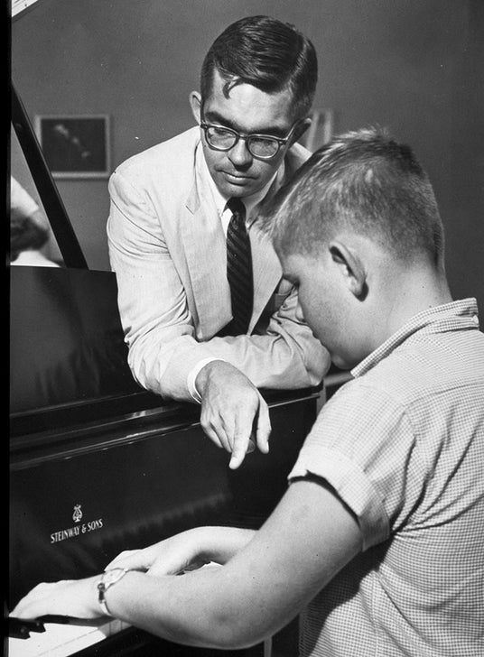 Robert Schmitt and student playing piano