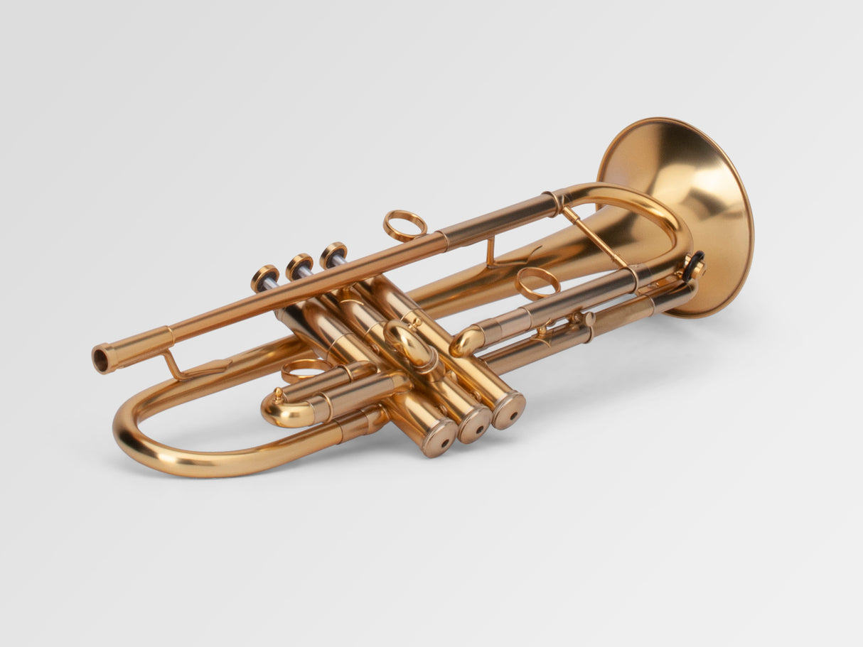 Adams A1 Bb Trumpet - laying down, slightly ajar with bottom of valves in front