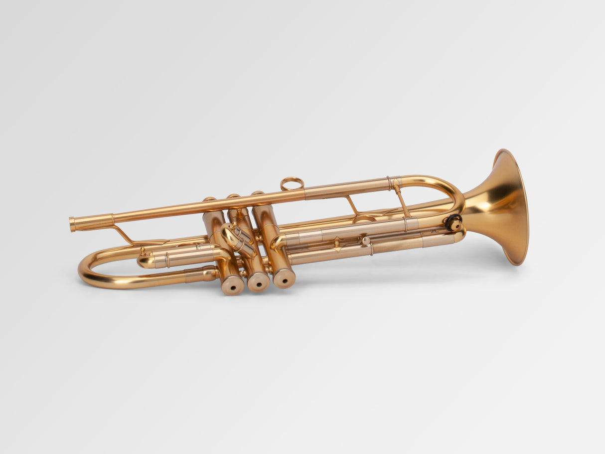 Adams A1 Bb Trumpet - laying down, bottom of valves in front