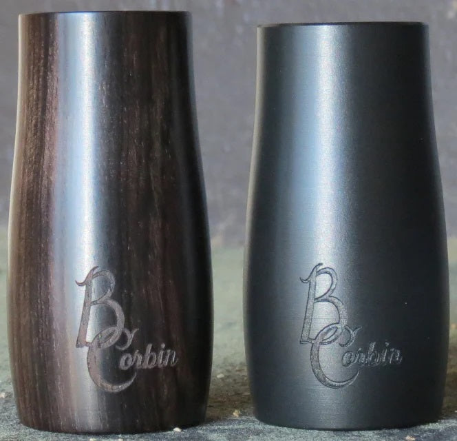 A synthetic and a grenadilla wood B. Corbin Traditional Barrel sitting next to each other.