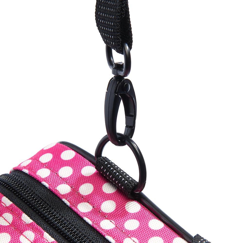 A close up on the metal strap clip of the Beaumont Pink Polka Dot Flute Box Case