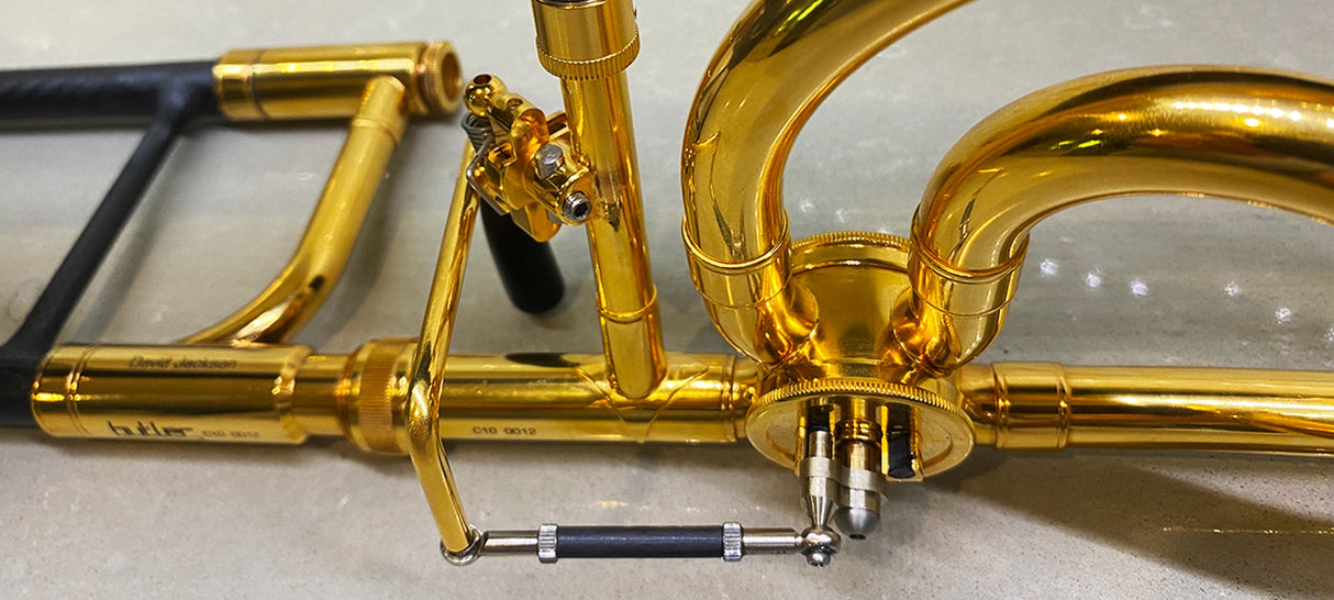 Butler C10 Large Bore Tenor Trombone - close up of bell brace and valve trigger