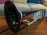 Butler Trombone C12 Bass Trombone - sitting on a coffee table in front of a couch