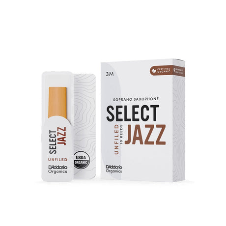 A box of D'addario Organic Select Jazz unfiled soprano saxophone reeds with a single reed sitting next to it