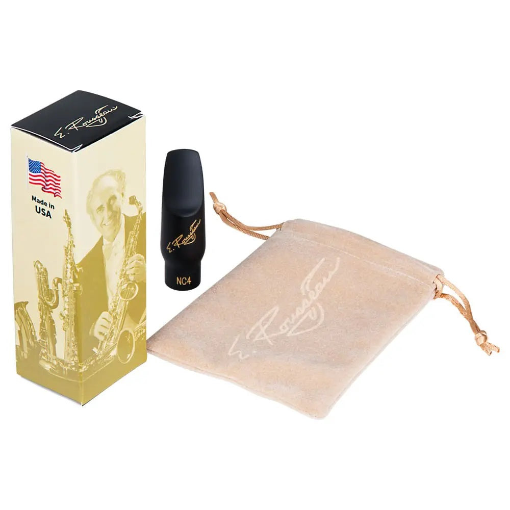 The Eugene Rousseau New Classic Soprano Sax Mouthpiece next to its packaging box and felt pouch