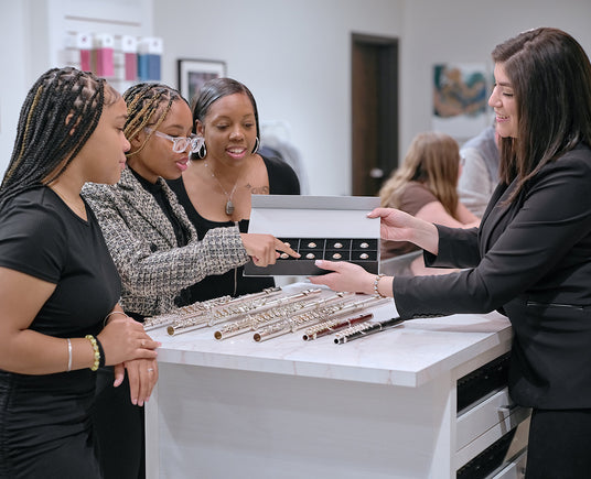 Bianca showing crowns to a family in the Flute Gallery