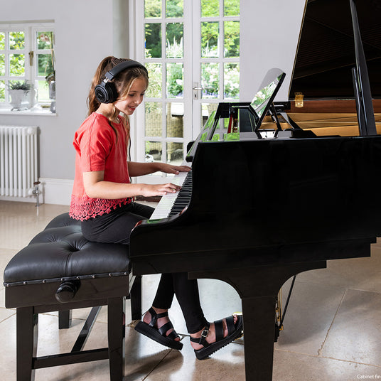 girl playing on the piano