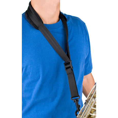 The Protec A310P padded saxophone neck strap being worn by a model