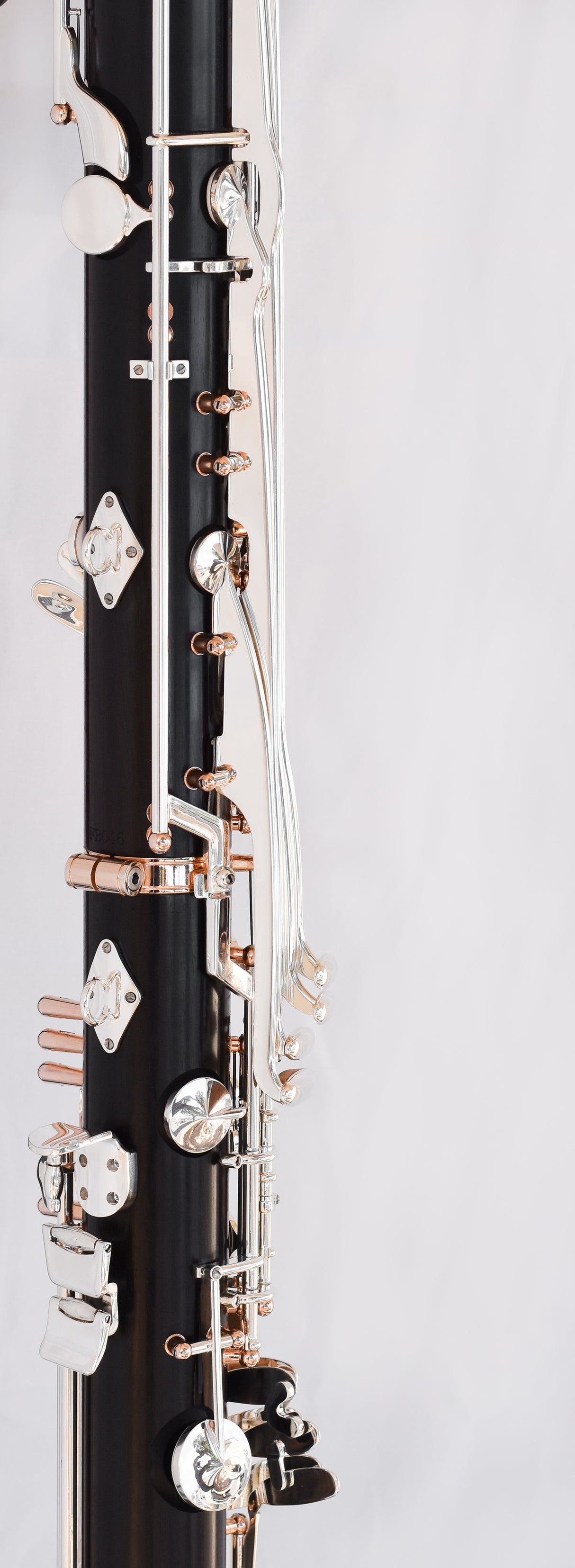 Royal Global Firebird Low C Bass Clarinet - close up side view of middle portion of instrument with the two joints connected