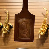 Close up of window side of the Sax Shop leather luggage tag