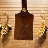 Up close view of the Sax Shop leather luggage tag