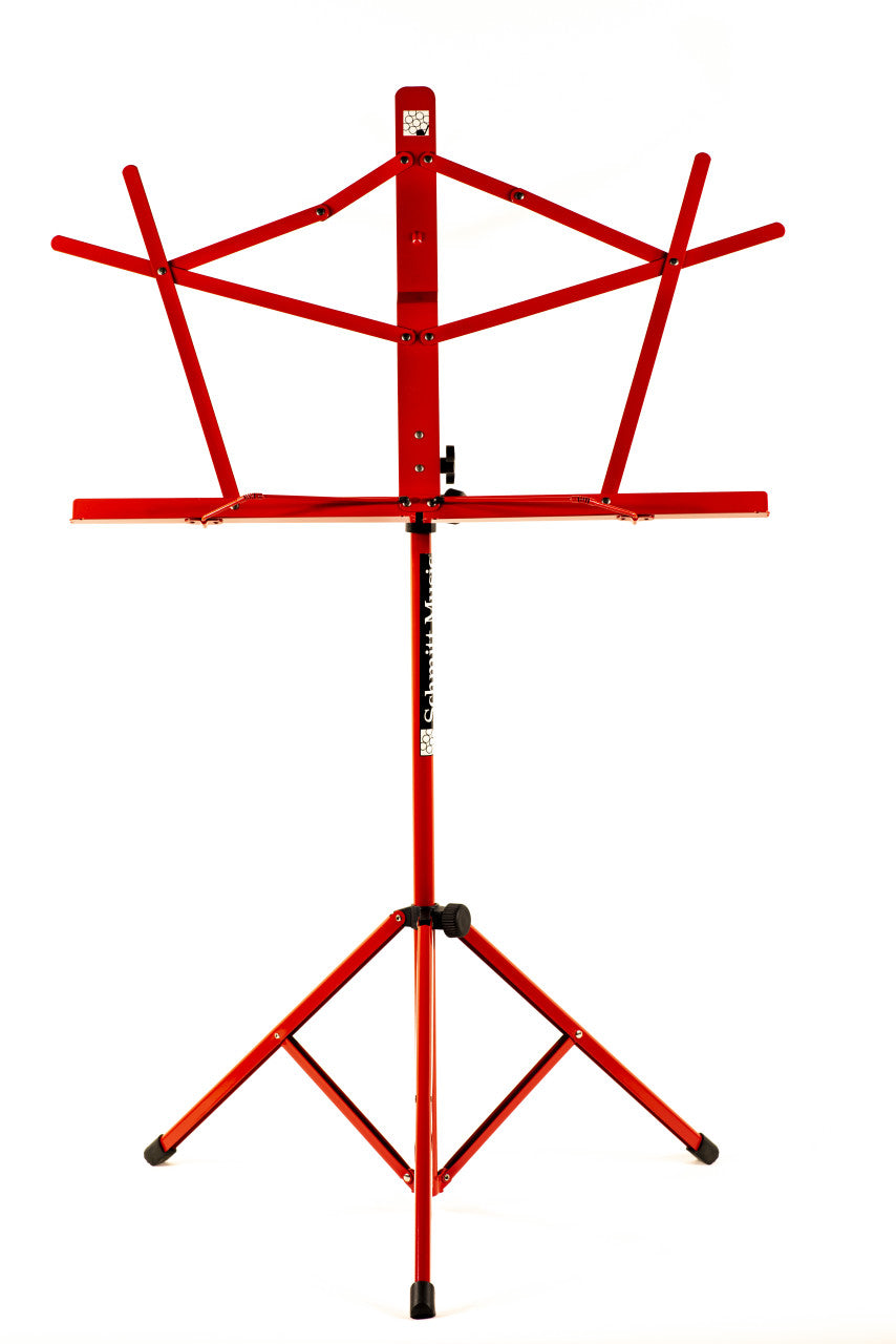 Red Schmitt Music folding music stand standing upright with its facing support flared open