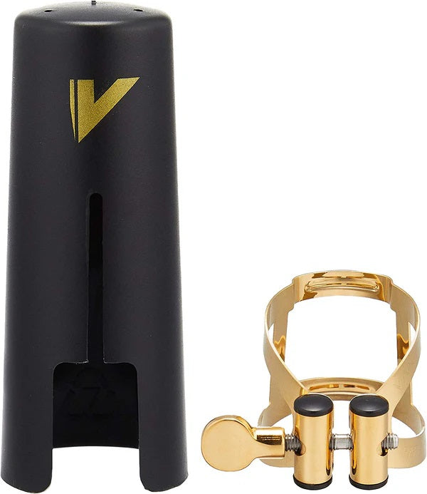 The gold plated Vandoren LC59DP MO baritone saxophone ligature and the plastic mouthpiece cap