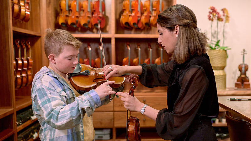 Student at Violin Shop trying a step up instrument